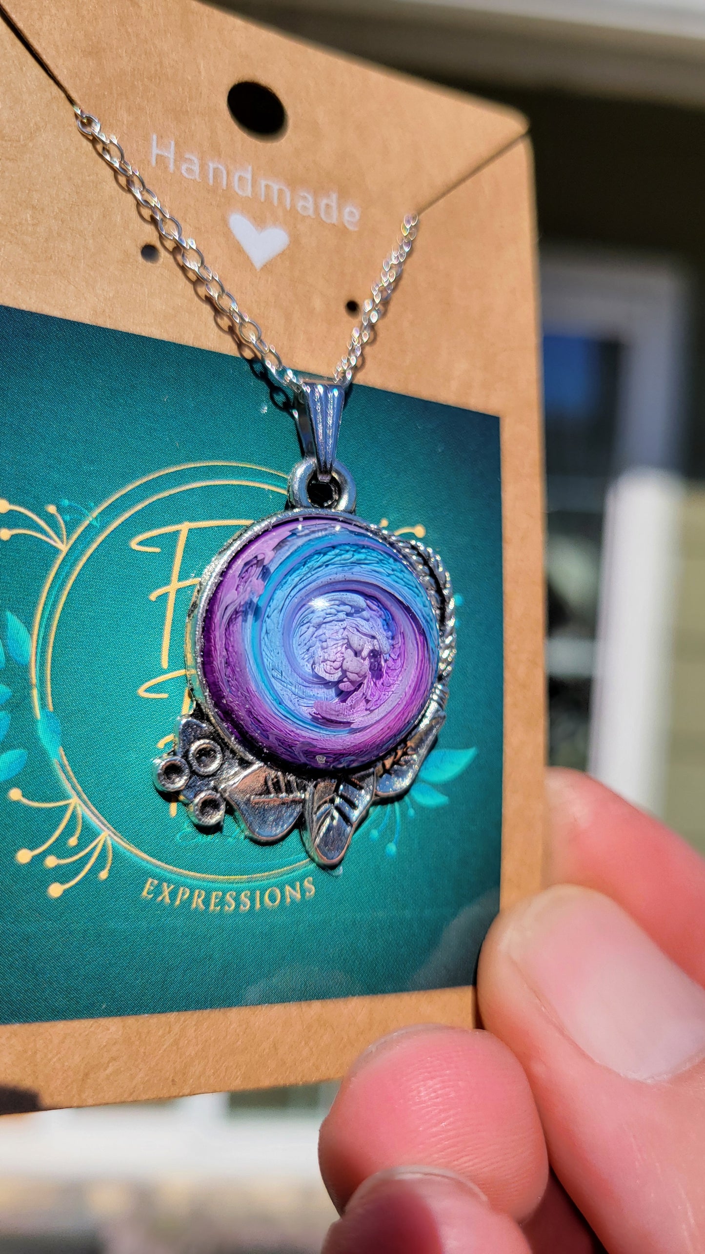 Handmade Resin Art Pendant with 20-inch sterling silver necklace chain.