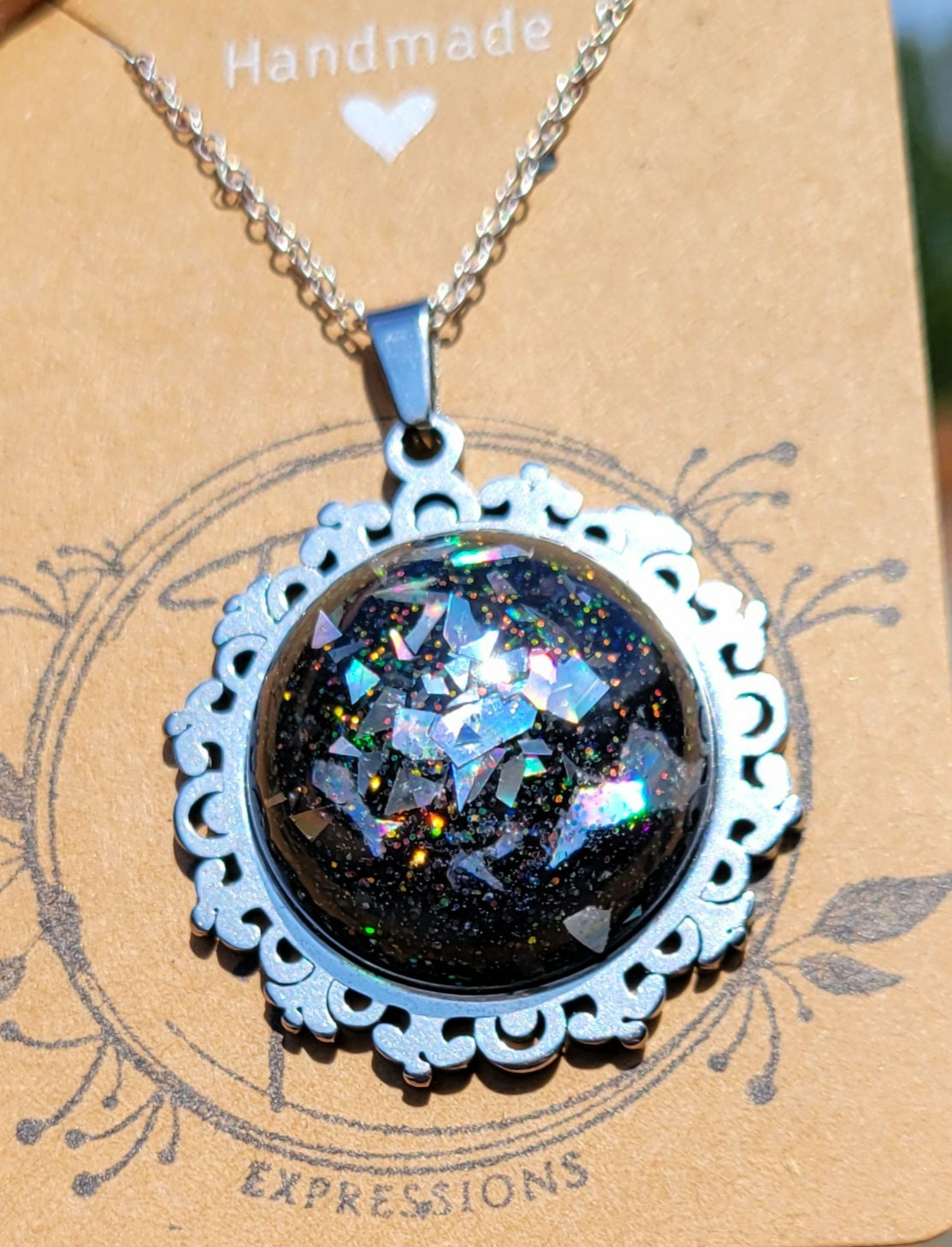 Handmade Resin Art Pendant with 20 inch silver plated necklace chain.